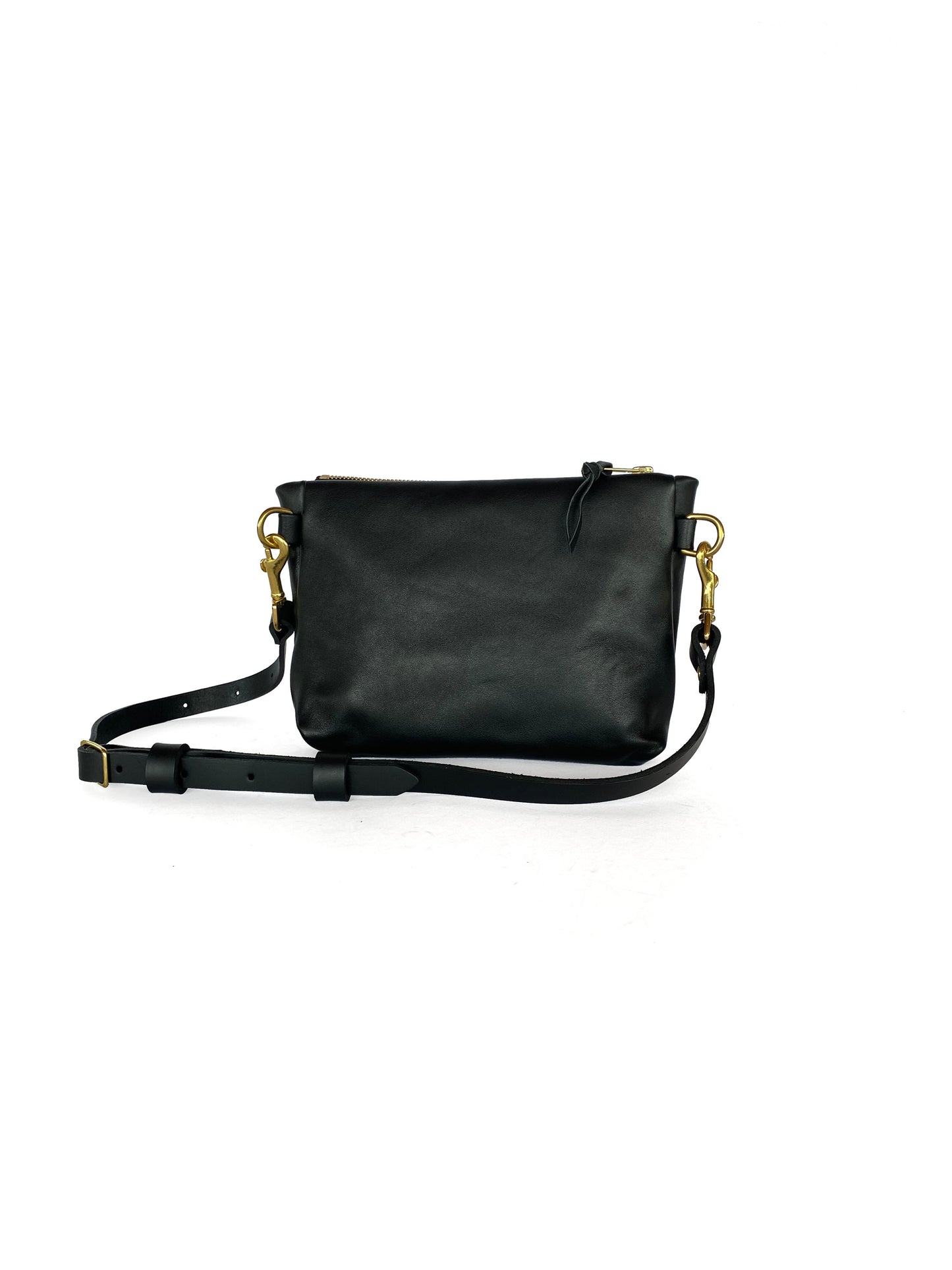 Studio pothos Cosmos bag in black with brass hardware.