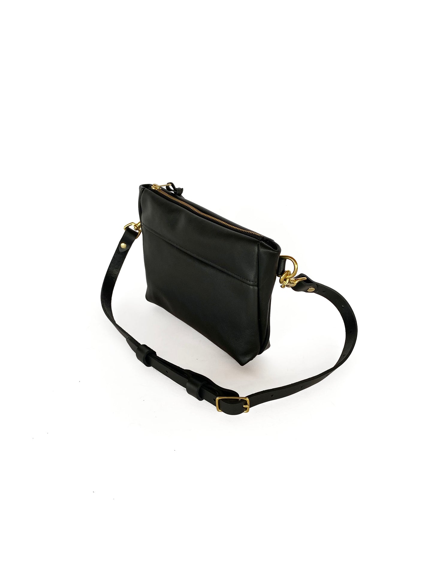 Studio pothos Cosmos bag in black with brass hardware. 