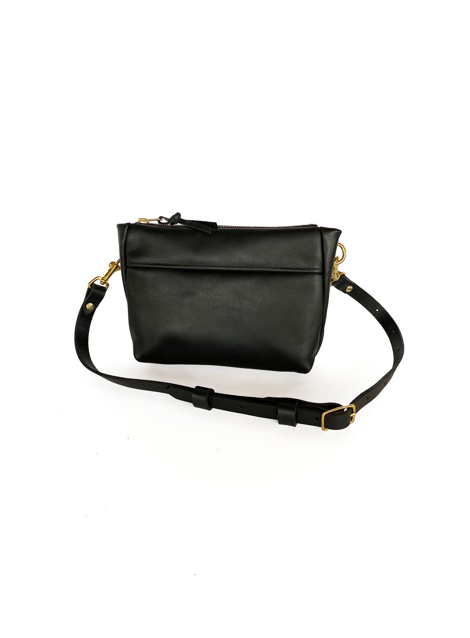 Studio pothos Cosmos bag in black with brass hardware.